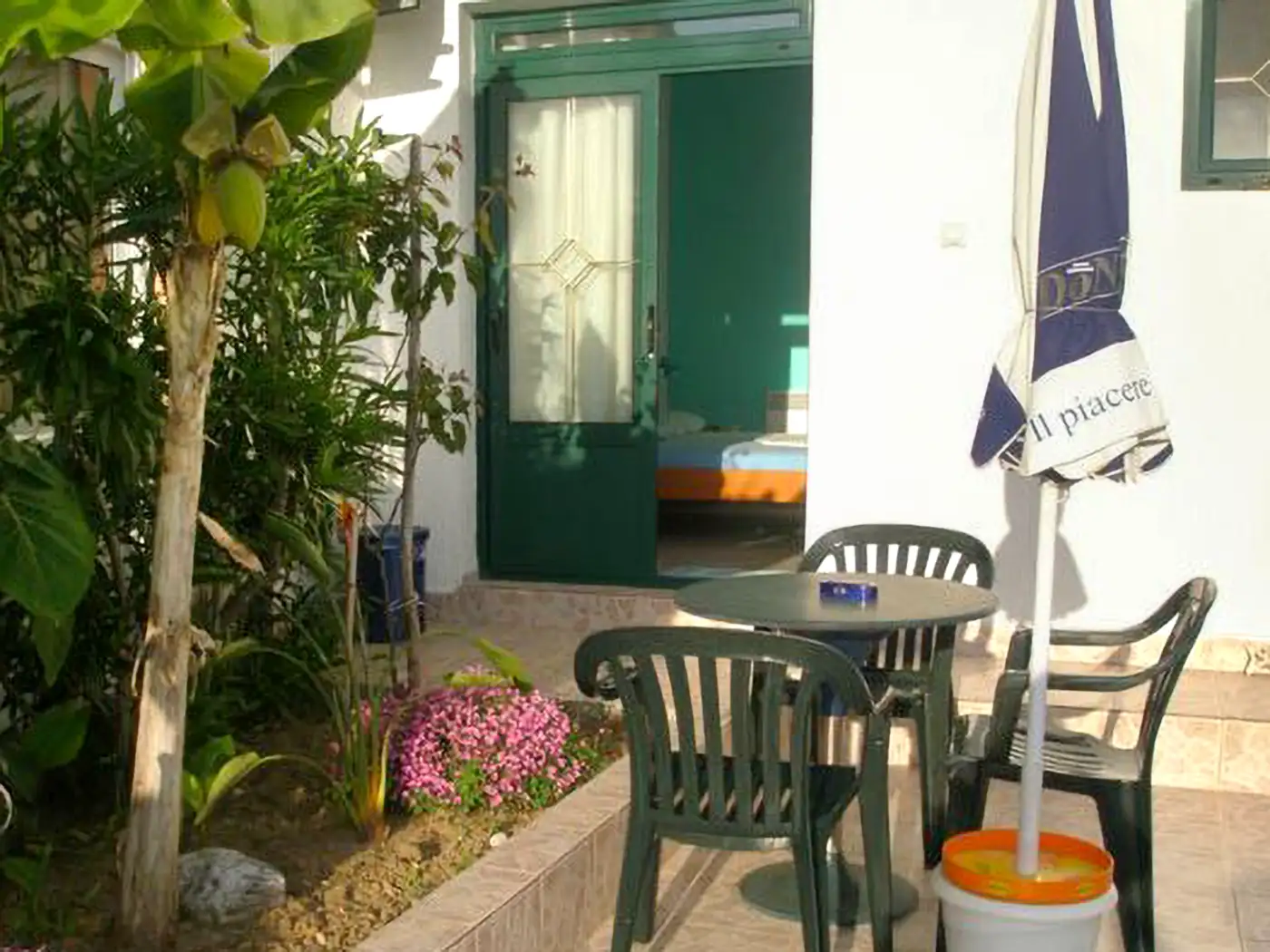 Guest room terrace at Bogumila in Utjeha with garden seating area